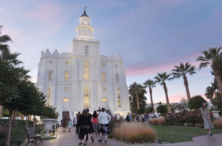 Visitors to the St. George Utah Temple walk the temple grounds.